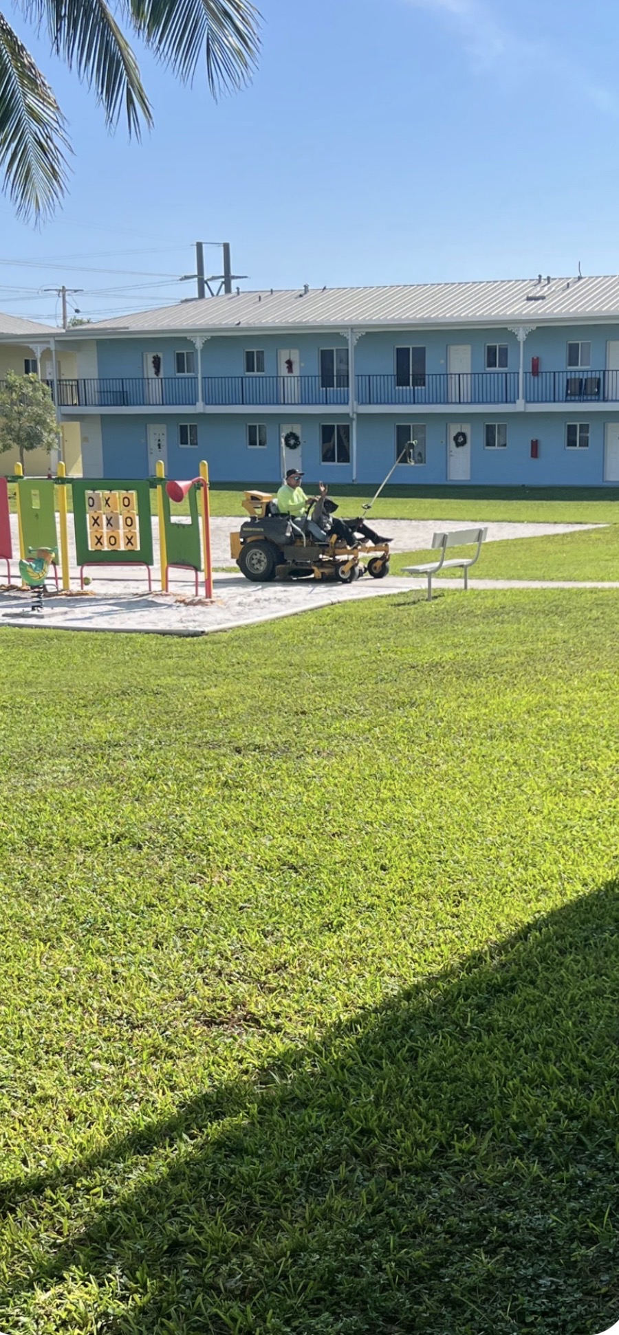 Riding mower service on apartment complex grounds in Key West